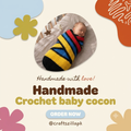 A handmade crochet baby cocoon swaddled in bold yellow, blue, red, and black stripes, shown in a circular photo frame within a promotional graphic. The graphic includes decorative abstract shapes and text reading 'Handmade with love! Handmade Crochet baby cocoon' and 'ORDER NOW @craftszillapk'.