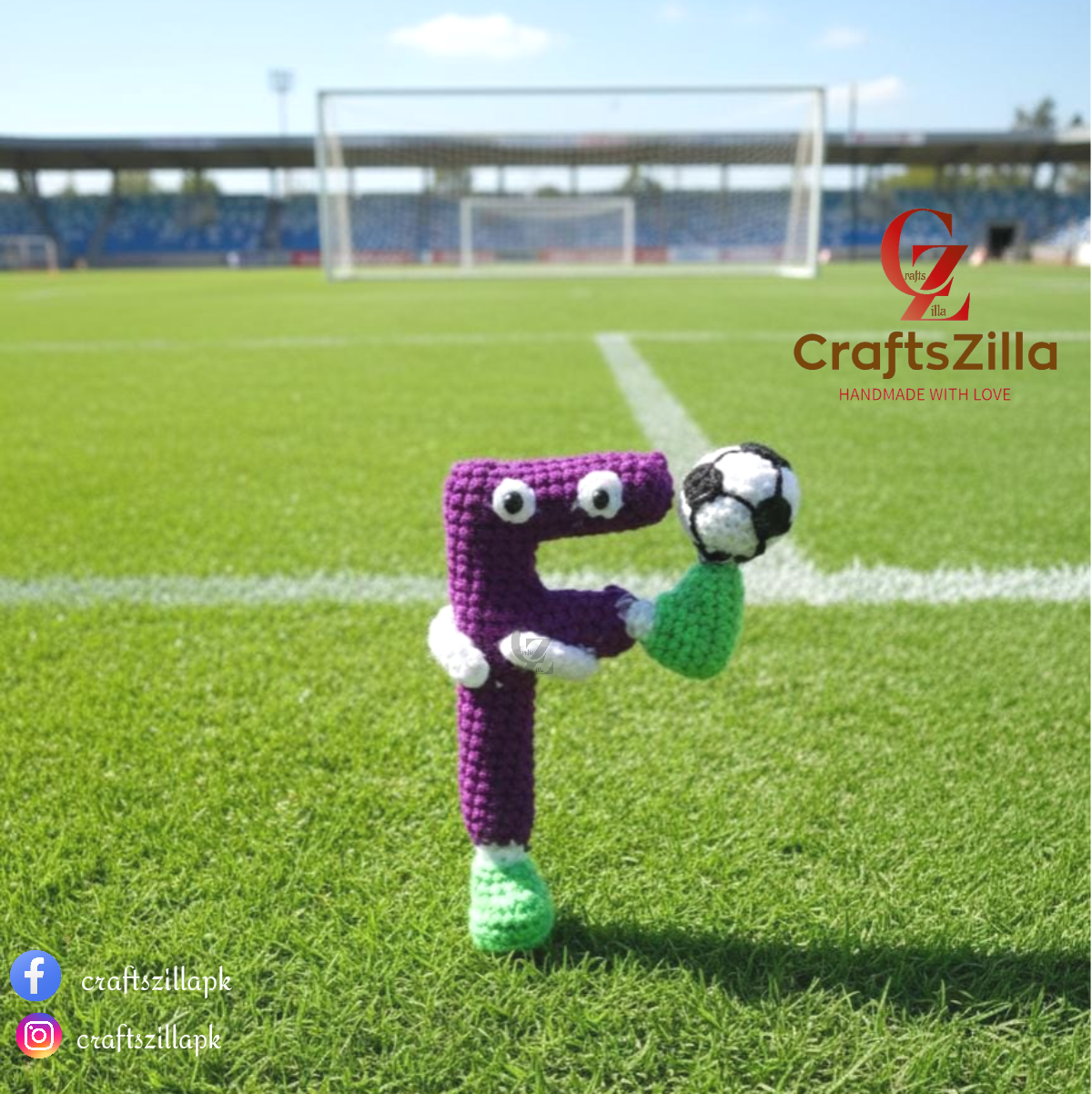 A crocheted letter 'F' toy character with a purple body, green feet, white gloves, and a black-and-white soccer ball, standing on a green soccer field with stadium stands in the background. The CraftsZilla logo is visible in the top right.